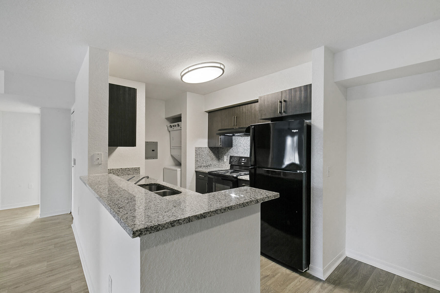 A bright, open kitchen at the Brenton at Abbey Park Apartments in West Palm Beach, Florida.
